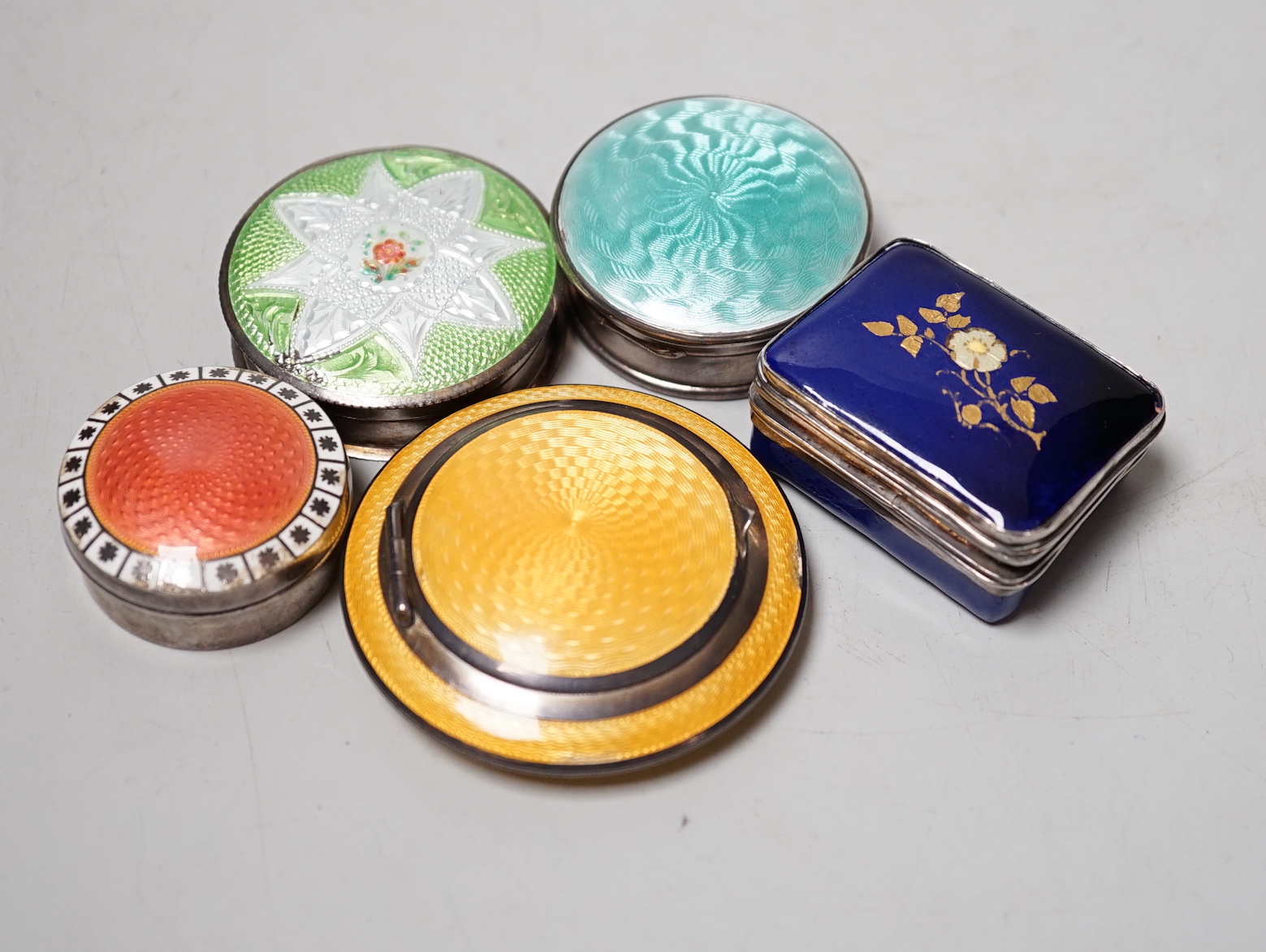 Three assorted silver and enamel boxes including a compact, one sterling and enamel box and one other enamelled box, largest 60mm.